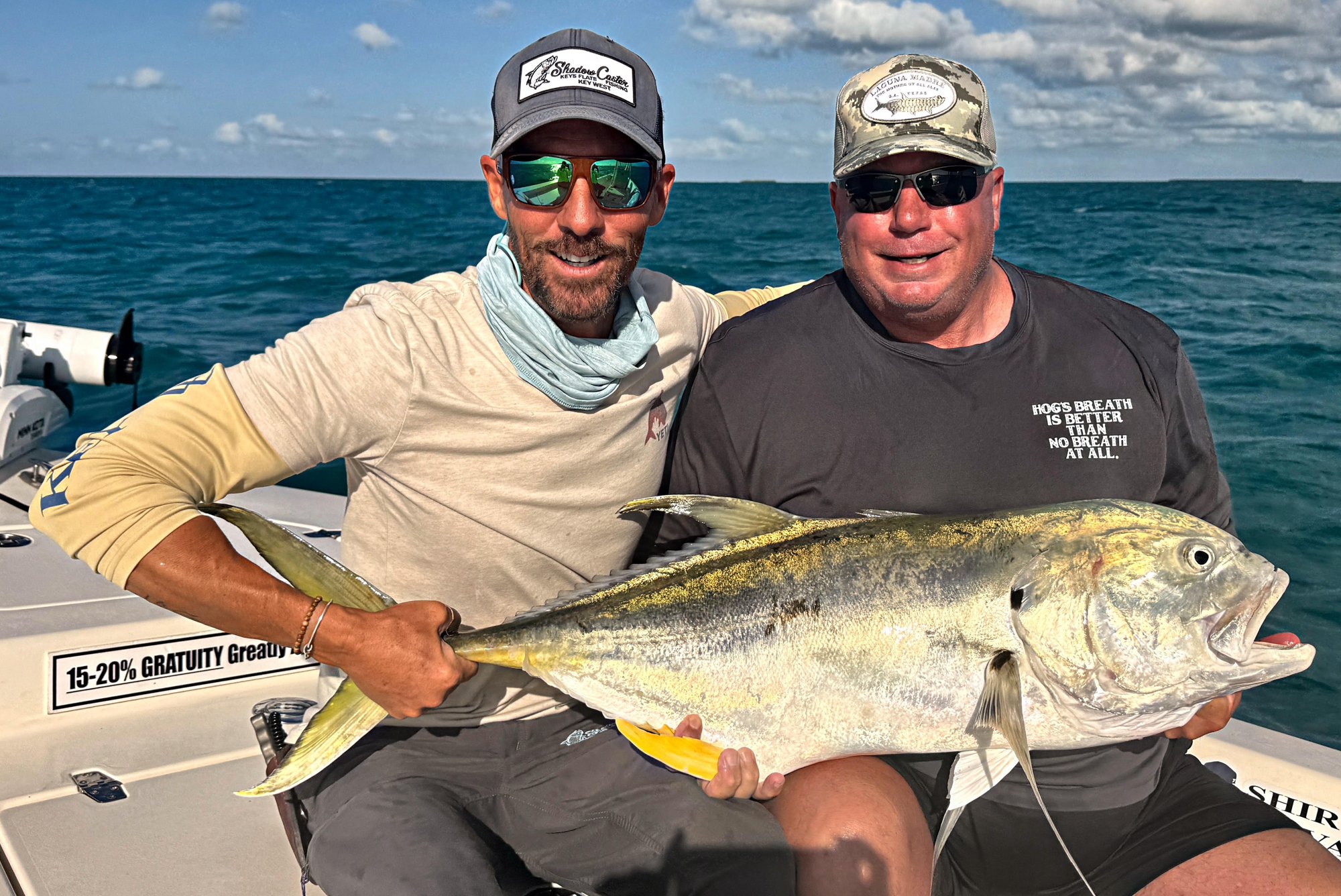 Two anglers holding a jack crevalle on a Marquesas run out of Key West