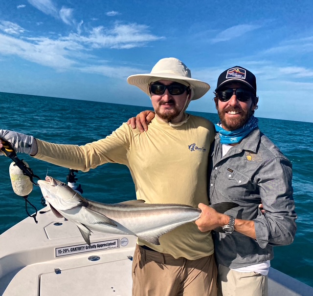 Two anglers with a cobia caught out of Key West