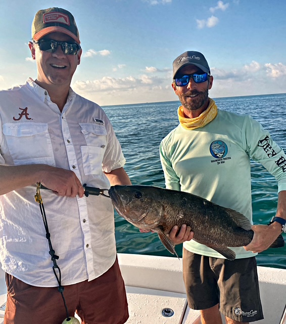 Two anglers with a grouper caught near Key West