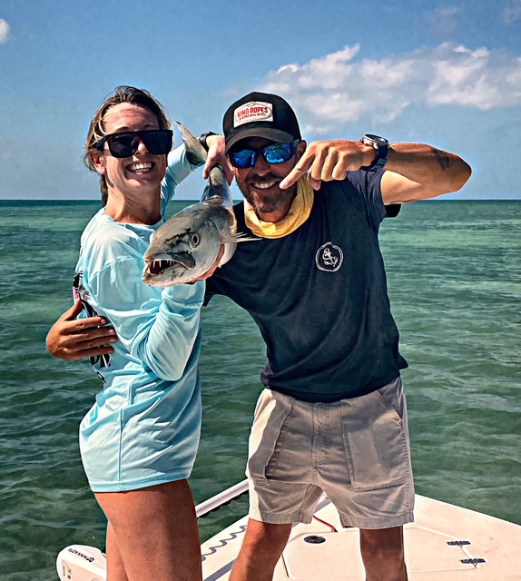 Couple holding a bonito caught off Key West