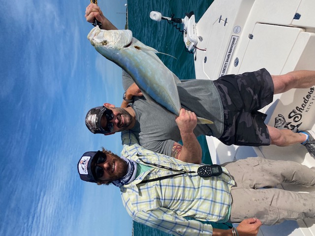 Two anglers with an amberjack caught off Key West