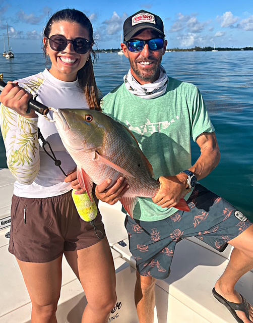 Two guests with a mutton snapper caught near Key West