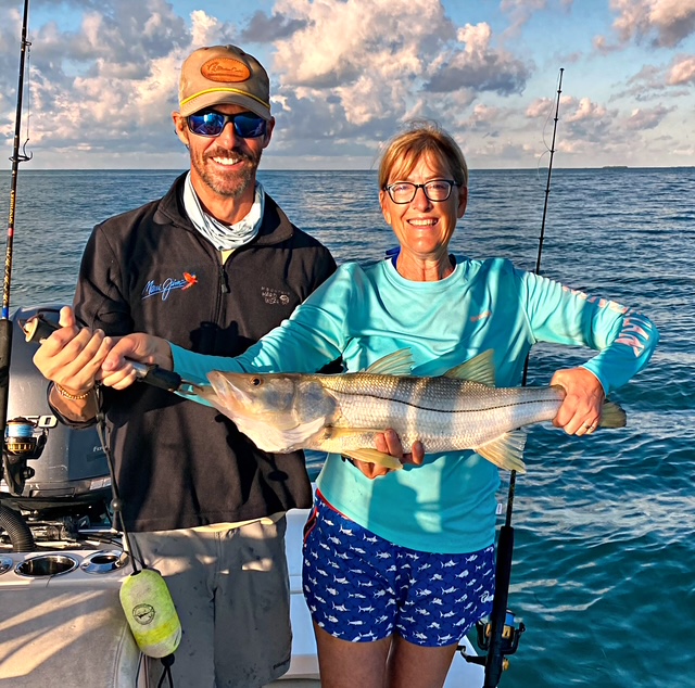 Couple holding a snook caught out of Key West