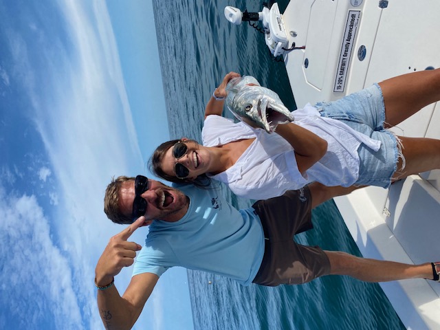 Couple with a barracuda on a Key West charter