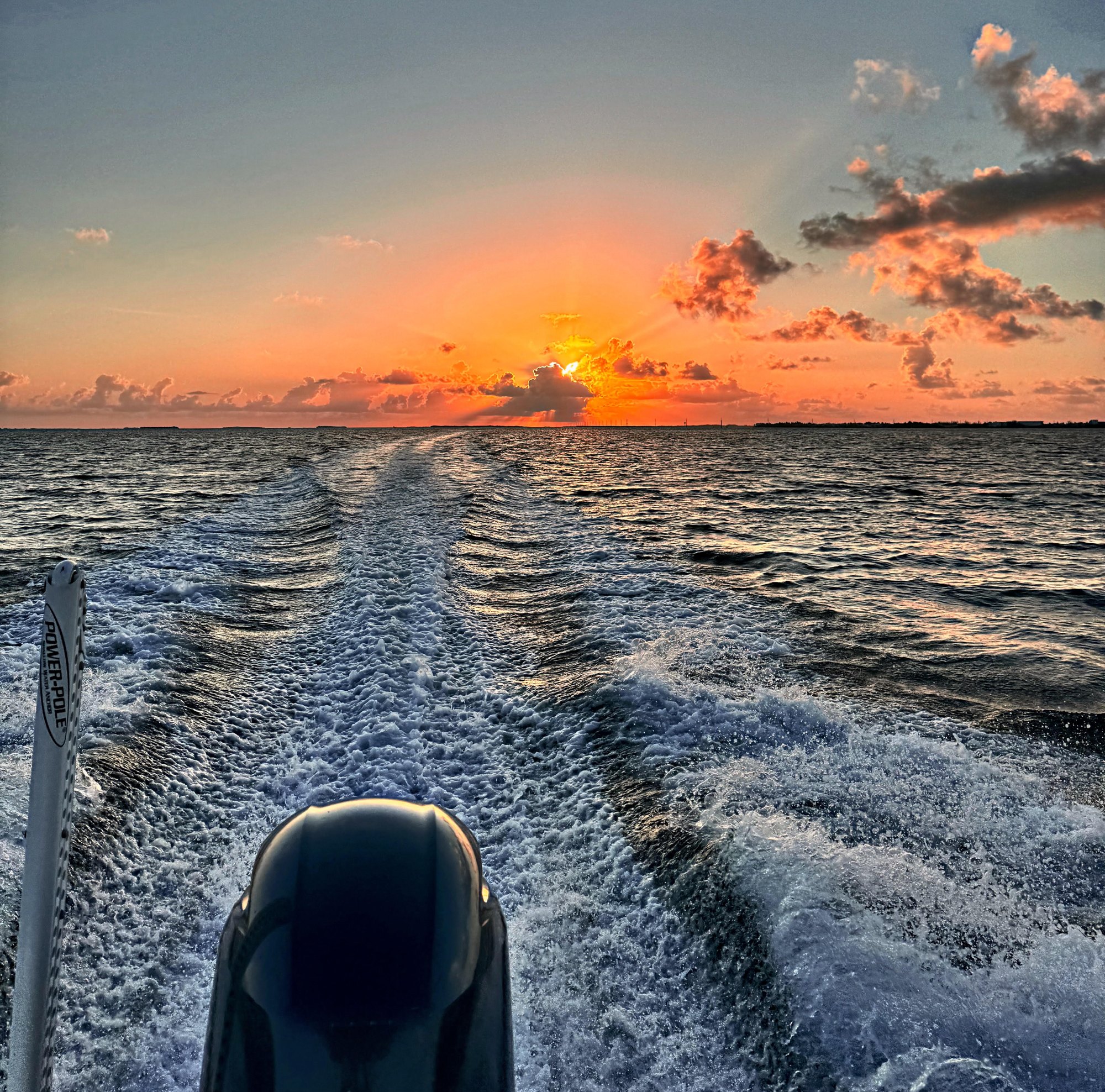 Sunset fishing charter running home across the Key West backcountry